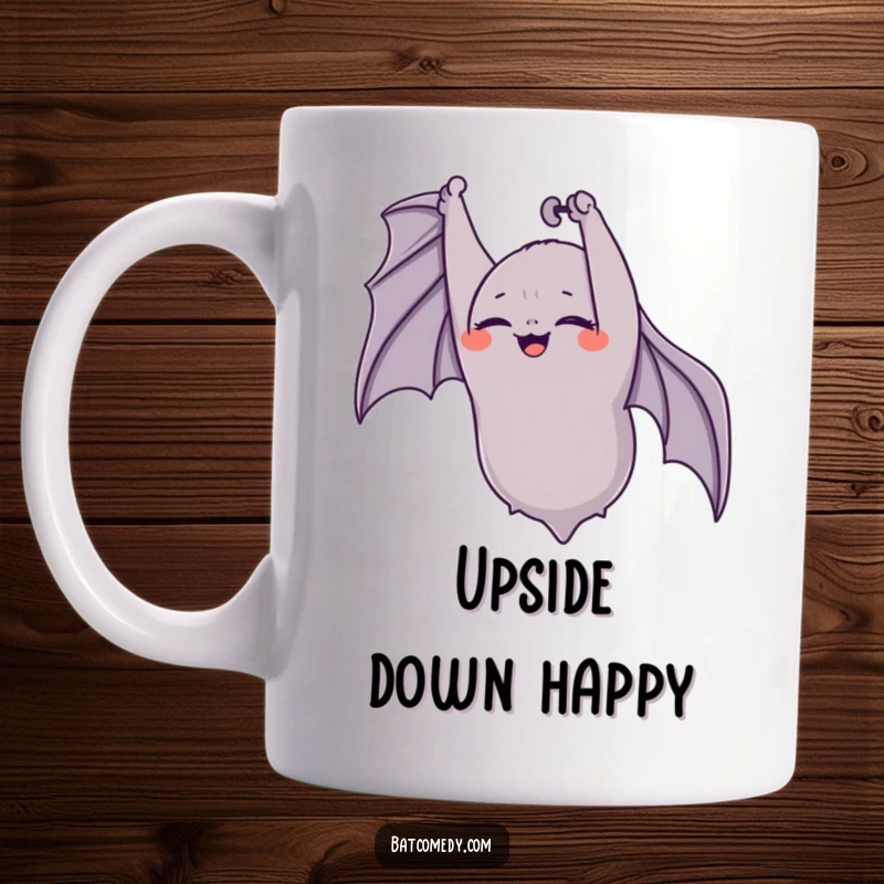 Funny bat mug showing a bat hanging upside down with eyes closed, captured in a moment of pure, infectious giggling joy.