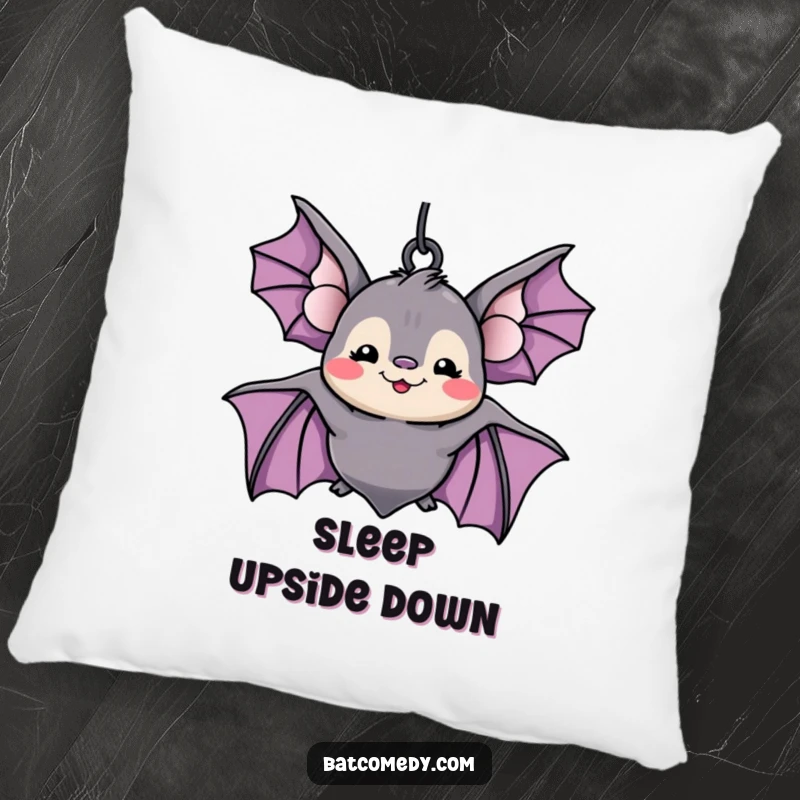 Funny kawaii bat with a wide, silly grin hanging upside down, printed on a soft pillow for humorous comfort.