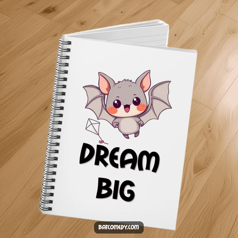 Funny notebook cover featuring a black bat with excited eyes, attempting to fly a miniature kite.