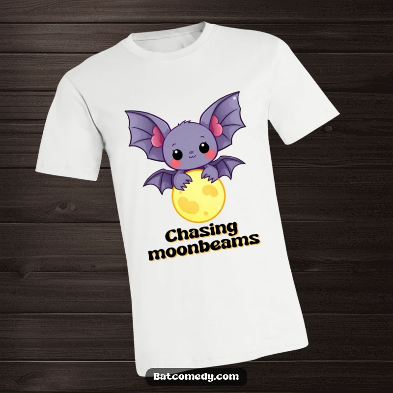 Funny kawaii bat holding a glowing moon charm, radiating nocturnal magic and gentle humor on a t-shirt.