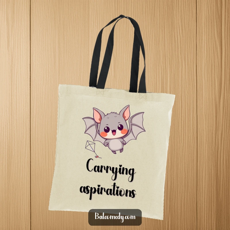 Funny tote bag featuring a black bat with excited eyes, trying to fly a miniature kite.