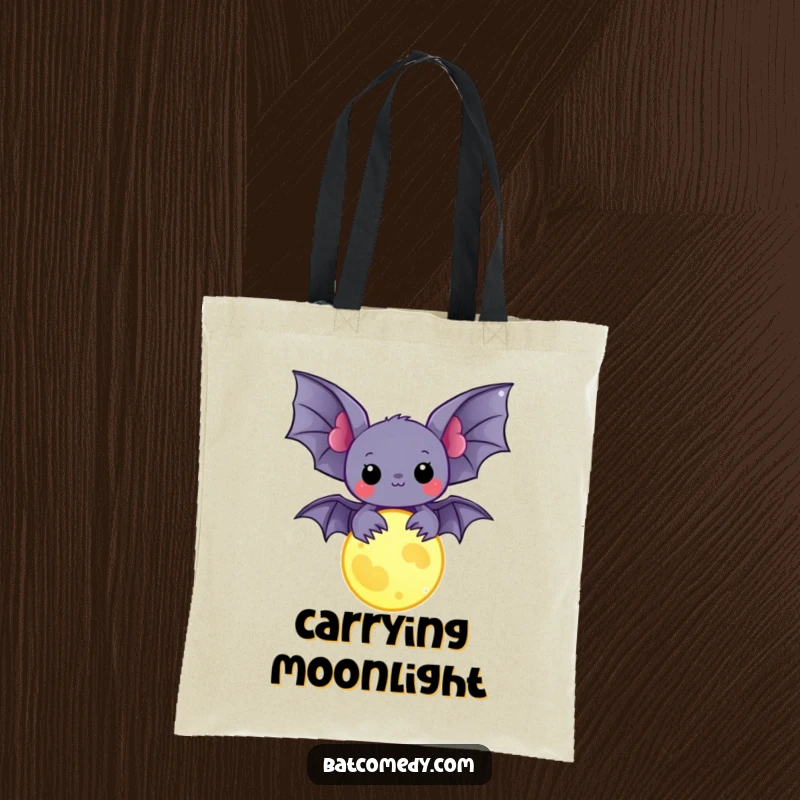 Funny kawaii bat holding a glowing moon charm on a tote bag, offering a blend of magic and humor for everyday use.