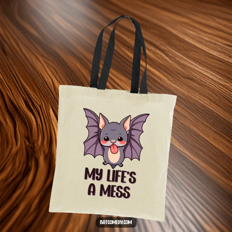 Funny tote bag featuring a cute bat flying upside down with its tongue sticking out, perfect for carrying daily items with a smile.